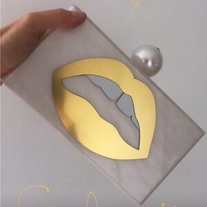 Lola Basso lip acrylic clutch